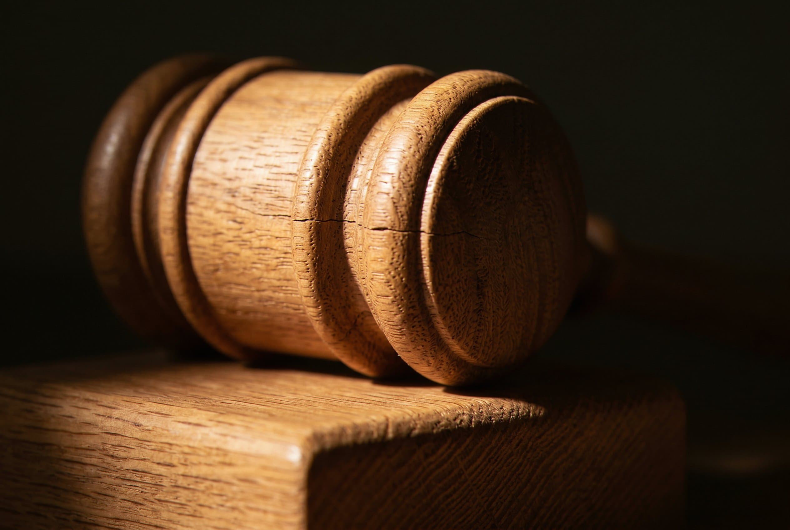 Judge's gavel on bench closeup